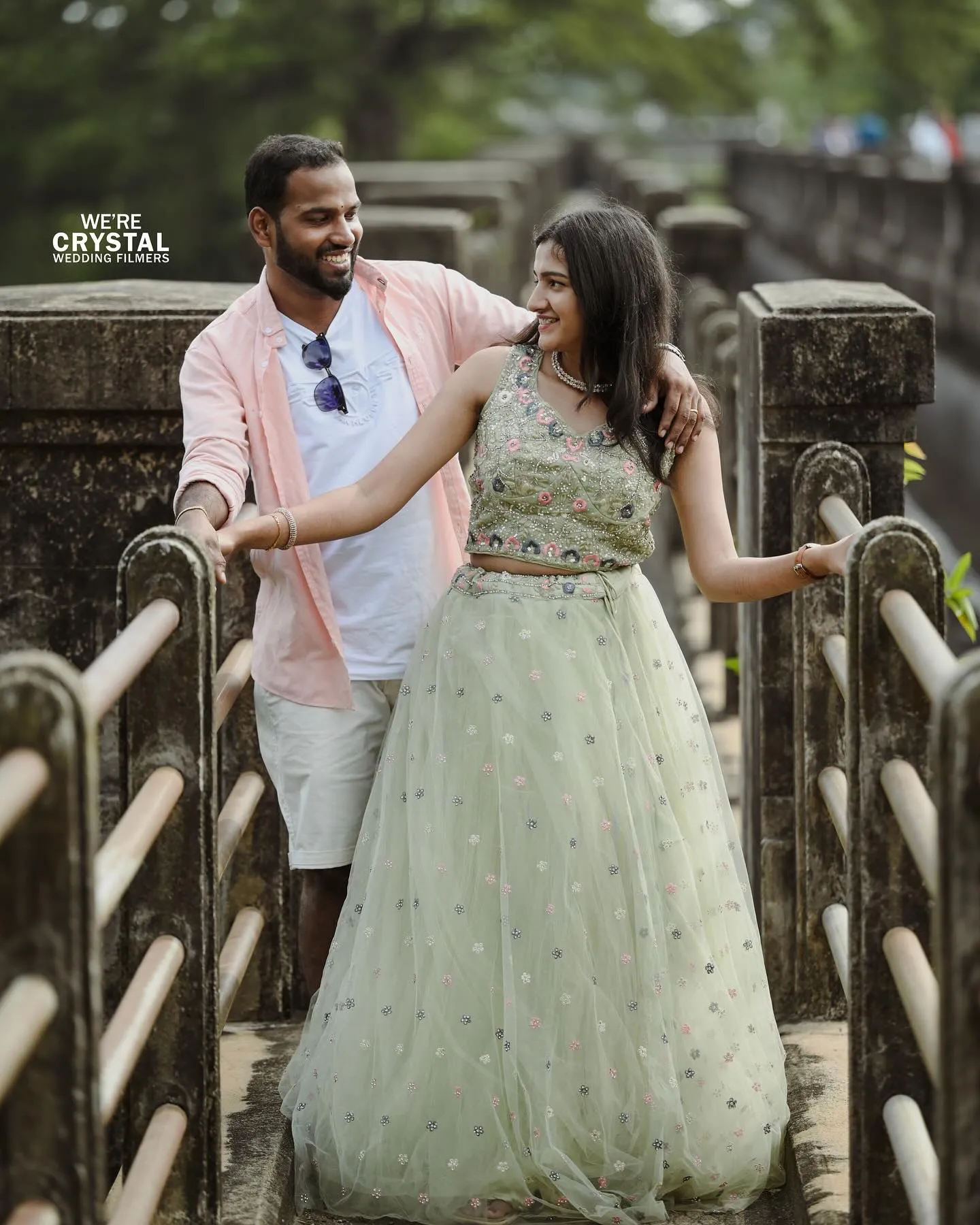 Couple posing in a beautiful doorway during their pre-wedding shoot in Palakkad.