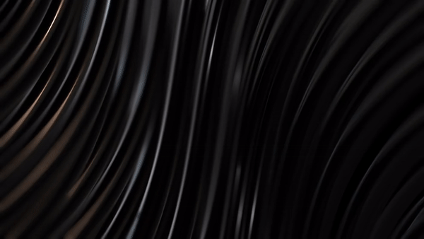 an abstract photo of a curved building with a blue sky in the background