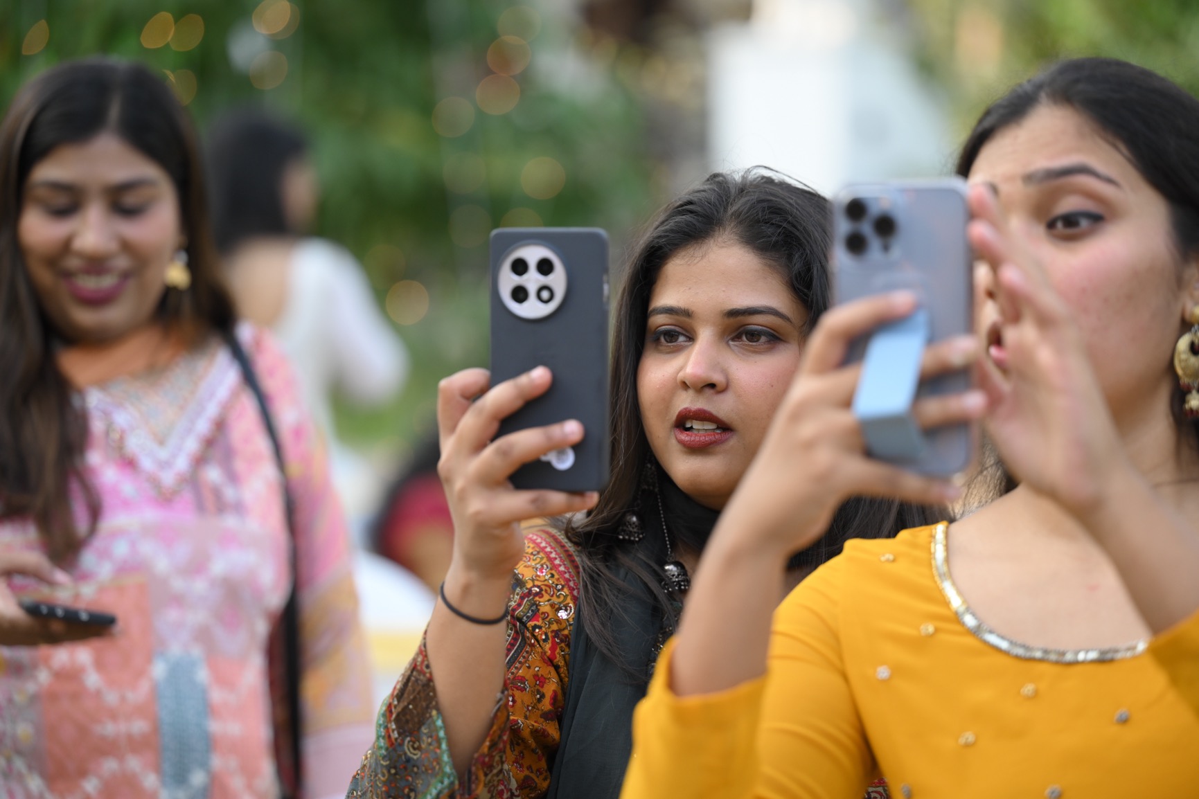brides maids clicking photos during an intimate wedding in kerala