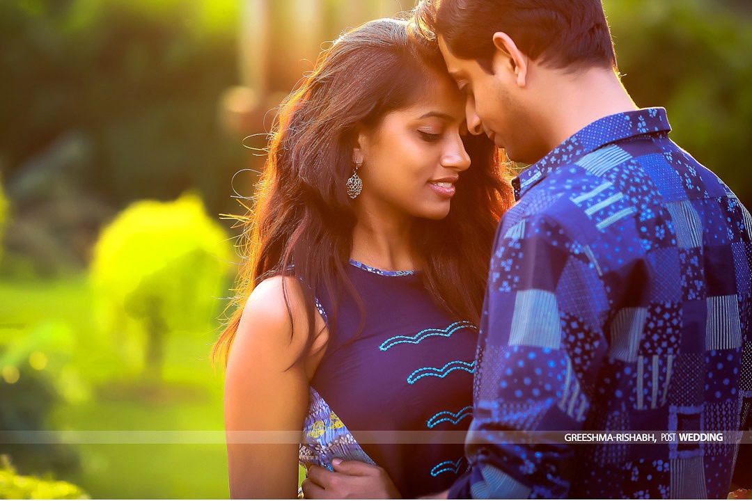 bride and groom in a blue attire during their kerala wedding photography session