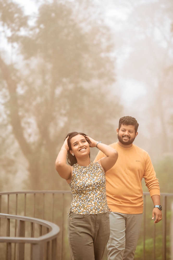 Stylish couple posing for their save the date in an urban Kerala setting.