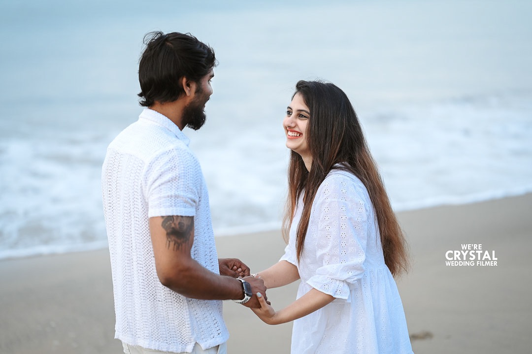 A silhouette of a couple against a stunning Kerala sunset for a save the date photo.