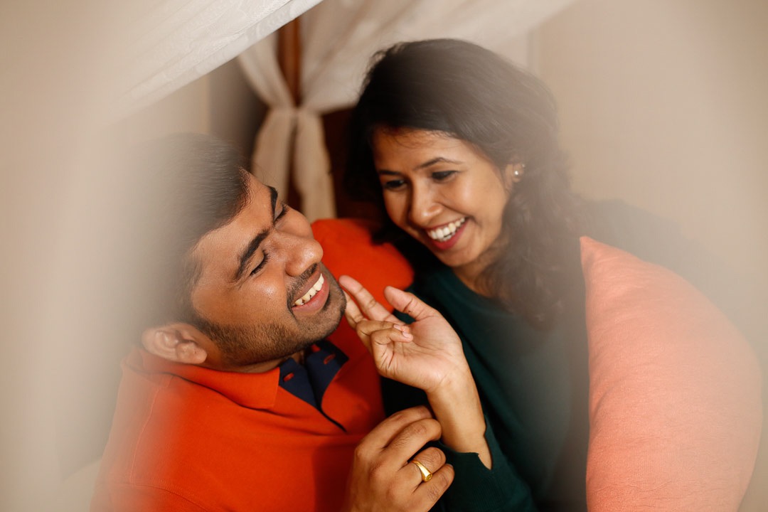 A close-up shot focusing on the couple's hands and rings for a Kerala save the date.