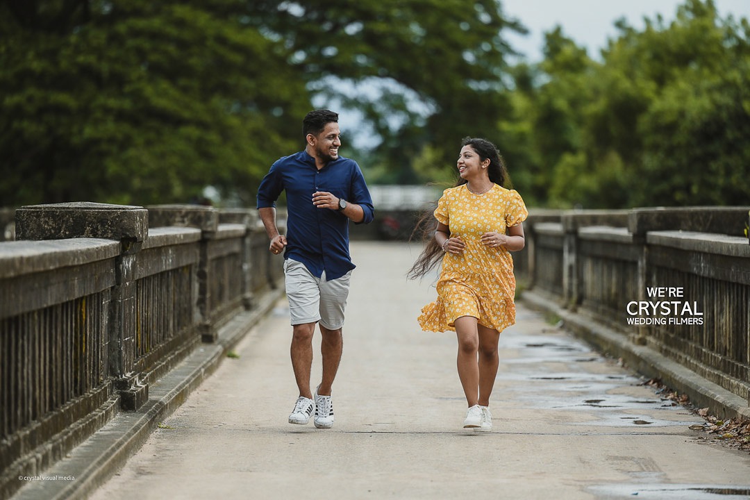 Couple surrounded by festival lights for a night-time save the date shoot in Kerala.