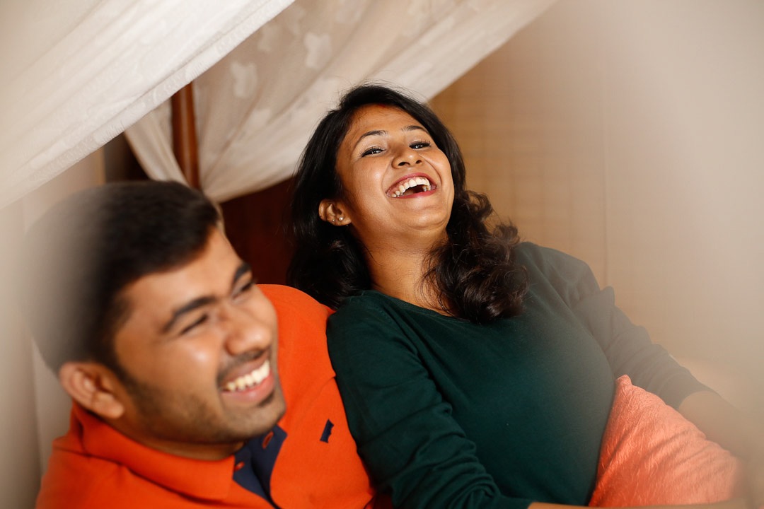 Pre-wedding photography on a beautiful Kerala road lined with trees.