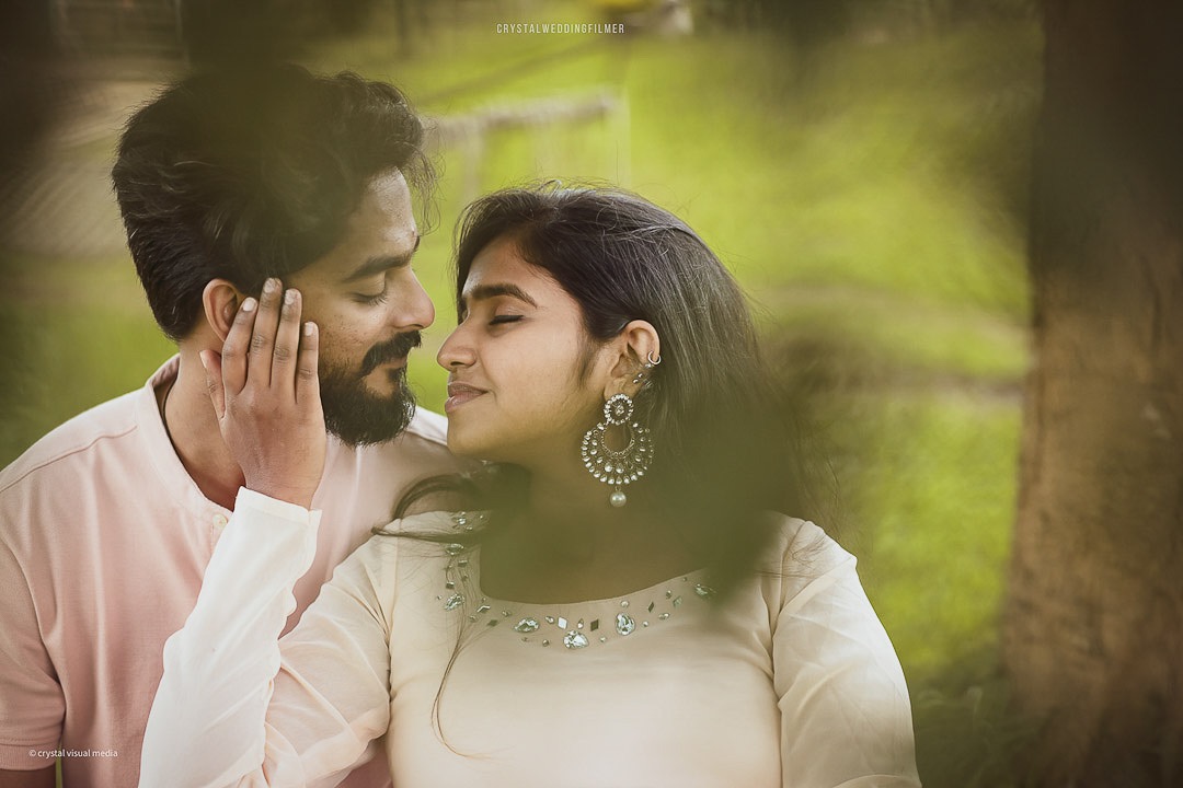 Pre-wedding photoshoot featuring a stylish couple in modern attire in Kerala.