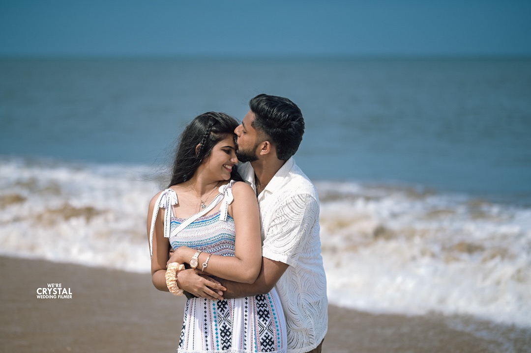 Intimate save the date photo of a couple in a traditional Kerala setting with kathakali.
