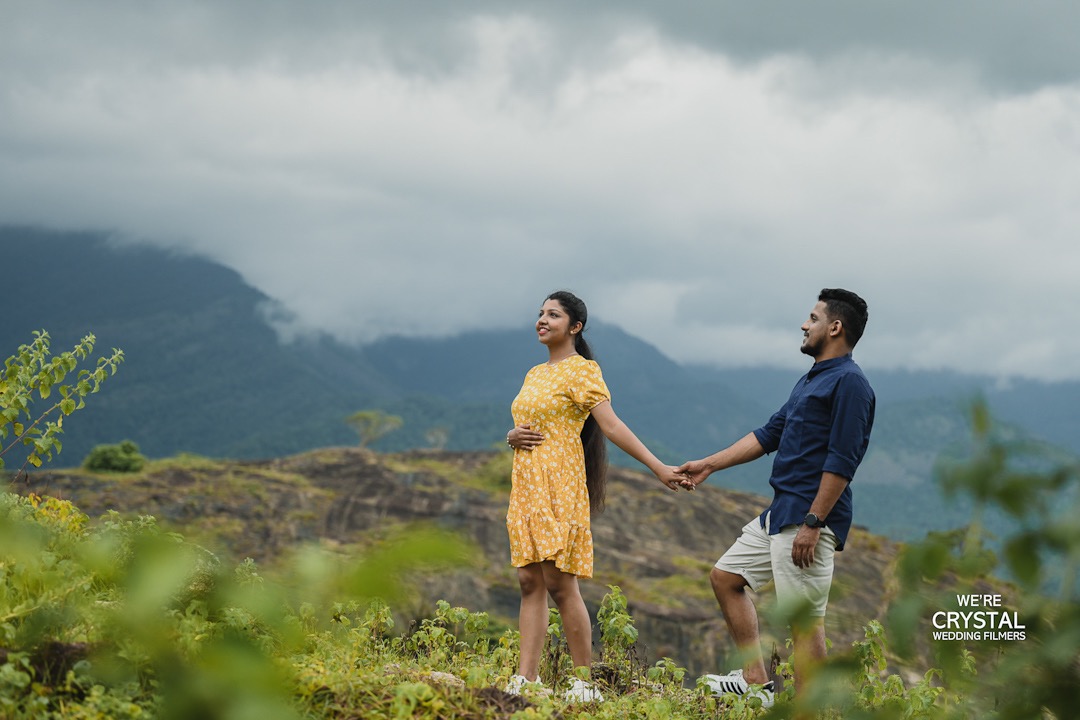 A cinematic pre-wedding photo with dramatic lighting in Kerala.