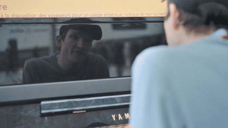 an abstract photo of a curved building with a blue sky in the background