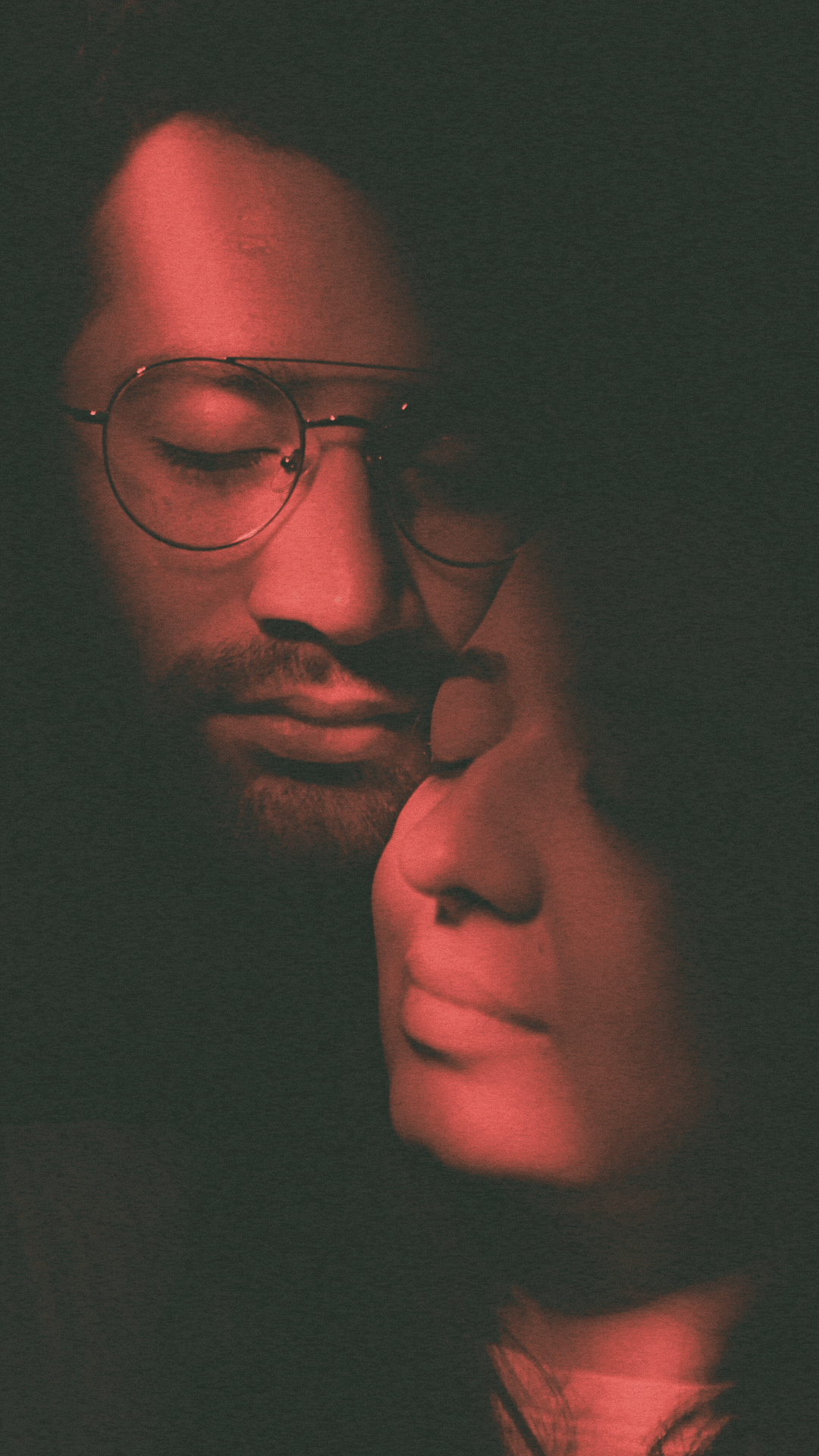 a close up of a black and brown abstract painting