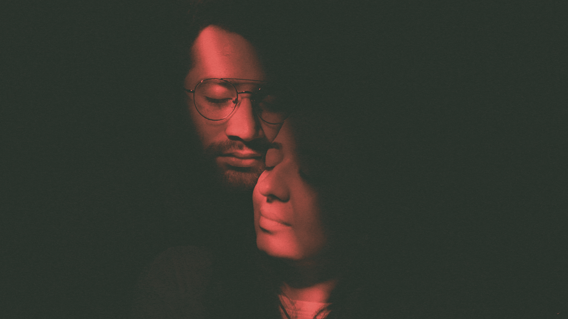 a close up of a black and brown abstract painting