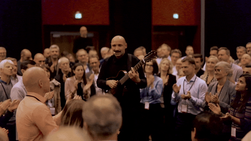 woman in white and brown dress standing on green grass during night time