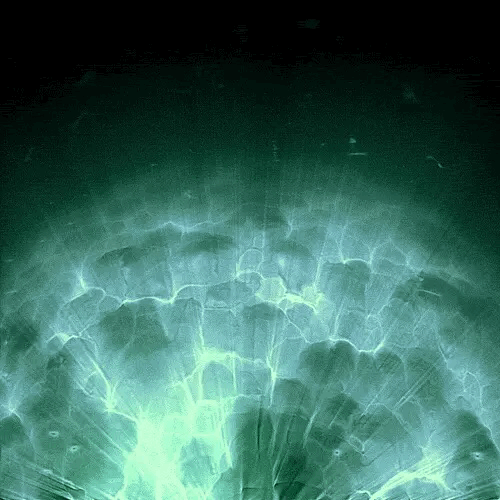 an abstract photo of a curved building with a blue sky in the background