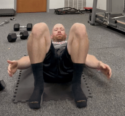 man doing heel touches