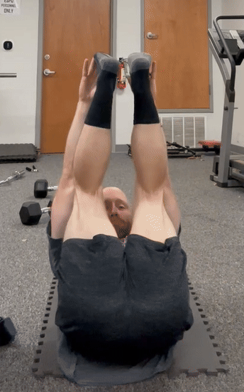 man doing toe touches