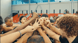 an abstract photo of a curved building with a blue sky in the background