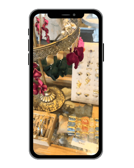 a phone screen showing a picture of a vase with flowers