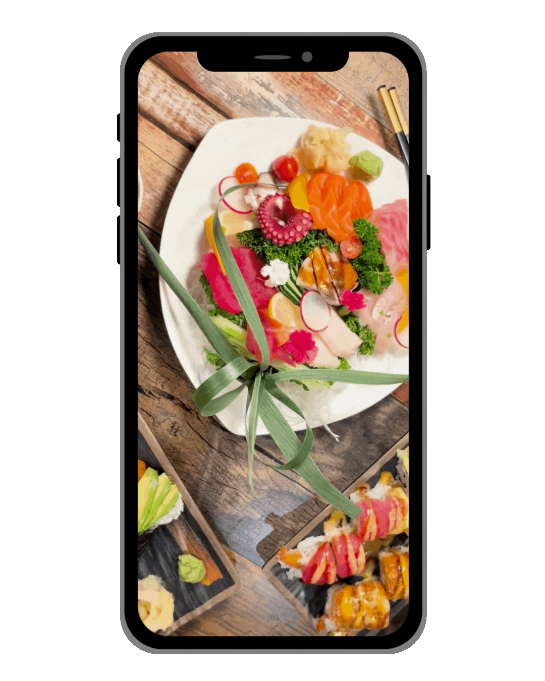 a plate of food on a table with a phone