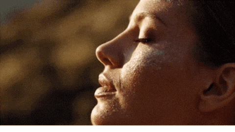 woman holding dried flower