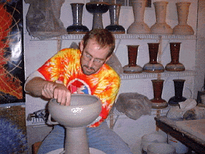 Patrick Brumm trimming a ceramic hand drum (dumbek)